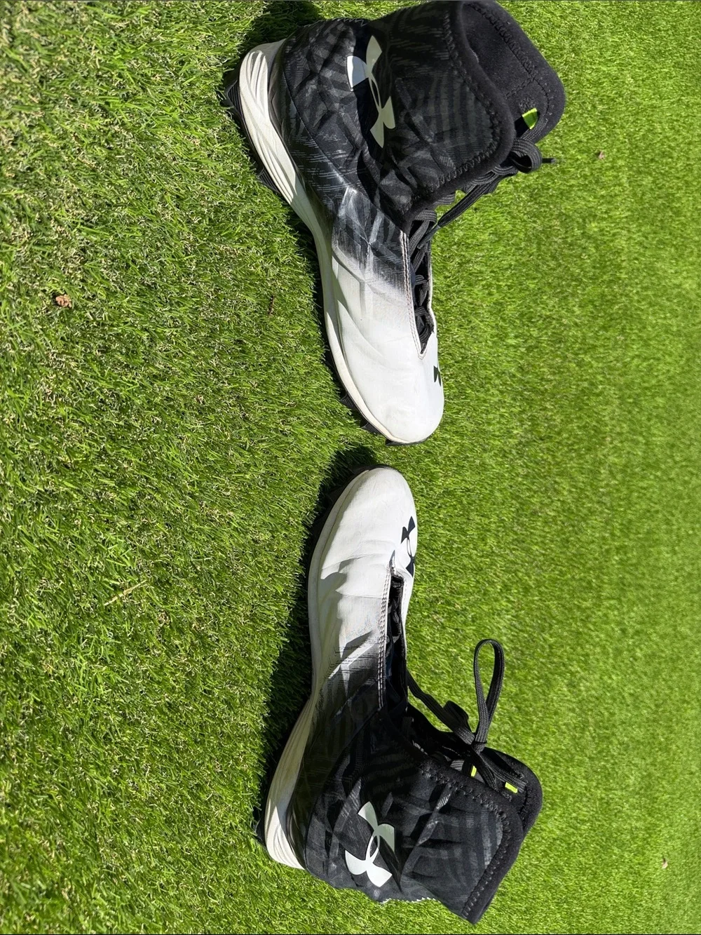 Under Armour Men’s White and Black High-Top Athletic Cleats